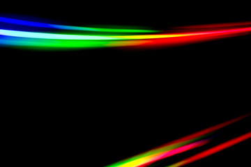 Colourful light beams being refracted from the surface of a DVD