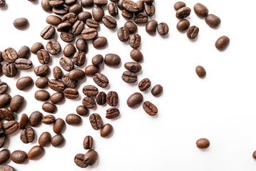 Roasted coffee beans isolated on white background. Close-up.