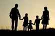 © Kostia - silhouette of a happy family with children