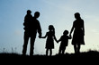 © Kostia - silhouette of a happy family with children