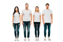 Full Length View Of Serious Young Men And Women In White T-shirts And Denim Pants Standing And Looking At Camera Isolated On White