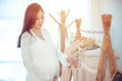© witthaya - Young asian pregnant woman choosing what to wear