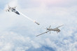 Combat fighter launches missiles at a target - uav unmanned military drone. Conflict, war. Aerospace forces.