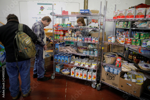 Volunteers Stock The Shelves Of Gather Food Pantry In Portsmouth