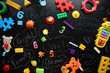 © dyageleva - Children's toys and accessories on a black background. View from above