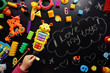 © dyageleva - Children's toys and accessories on a black background. View from above