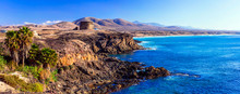 Landscapes Of Volcanic Fuerteventura - View With Toston Tower In El Cotillo. Canary Islands