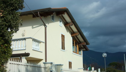 walls of a facade of an inhabited family house seen from the outside