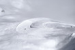 Aerial view of snow covered road with curve used as ski slope for downhill skiing in Switzerland