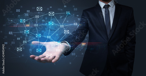 Cuadros en Lienzo Elegant businessman holding communication concept on his hand