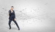 © ra2 studio - Young suited karate trainer doing karate tricks with chaotic concept
