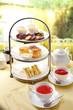 Delicious English afternoon tea set on a white background