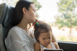 © globalmoments - Tired stressed mother traveling with her kid on the bus. Depression disorder.