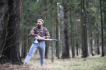 Wall Mural - A bearded lumberjack with a large ax