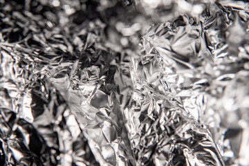  Silver foil closeup texture. Black and white abstract background. Foil crumpled.