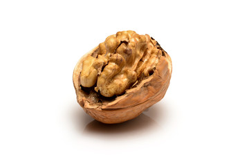 Wall Mural - Open walnut with full kernel, close up macro, isolated on a white background.