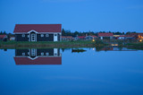 Fototapeta Tęcza - scandinavian house at the lake with reflection in the water
