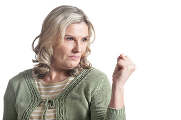 Portrait of angry mature woman posing isolated