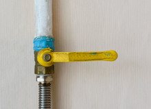 Old Ball Valve With A Yellow Handle To Shut Off The Flow Of Gas. Pipe And Hose Connection. Gas Pipeline. Ball Valve.