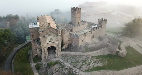 Wall Mural - Aerial view of impressive medieval castle of Xavier with attached Basilica on hill in town of Javier, Navarre, Spain