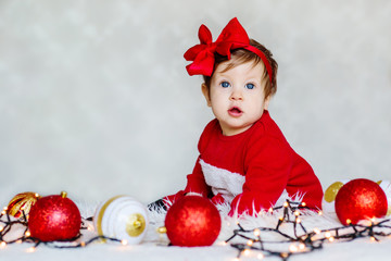 Christmas portrait of adorable baby Santa's helper