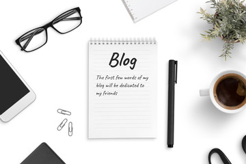 Poster - Concept of blogging and freelancing. A few blog words on a pad paper on office desk.