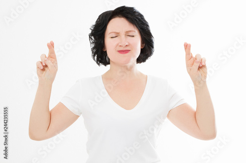 Cuadros en Lienzo Middle age woman cross fingers for wishing good luck isolated on white background