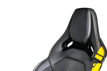 Black leather interior of the luxury modern car. Perforated Leather comfortable seats with yellow stitching isolated on white background. Modern car interior details. Car detailing. Car inside