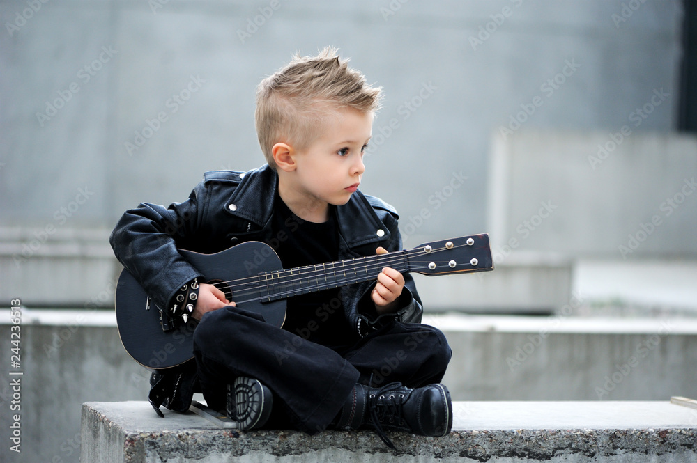 A Handsome Boy In Black Leather Jacket With Iroquois