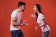 © My Ocean studio - Side view photo of young angry and shouting couple in white t-shirts