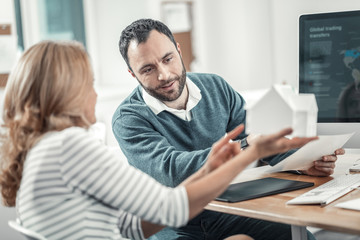 Nice adult smart people working together in the office