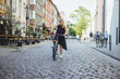 © Yuliya Kirayonak - Woman with bicycle on city street