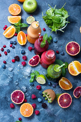 Wall Mural - Colorful detox smoothie in bottles, summer diet fresh drink for breakfast or snack.