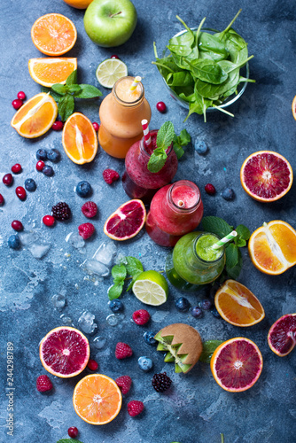 Fotografía Colorful detox smoothie in bottles, summer diet fresh drink for breakfast or snack