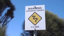 Venomous Snake Warning Sign In English And Chinese, Australia