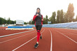 © Prostock-studio - Arabian girl running on stadium