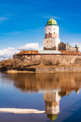 Sightseeing of Russia. Beautiful spring view to historical Vyborg ancient castle - medieval, famous fort in Vyborg town, a popular architectural landmark, LEningrad Region, Vyborg, Russia.