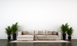 The loft living room and concrete wall texture background and brown leather sofa with plants