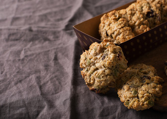 Wall Mural - Homemade oat cookies on dark grey or brown background