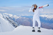 © ZoomTeam - Portrait of beautiful woman with ski and ski suit in winter mountain.