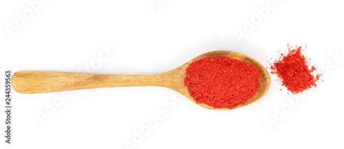 Fotomural sweet paprika spice in a wooden spoon isolated on white background