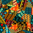 Colored african patchwork background with african motifs