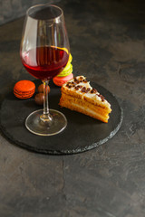 red wine, cake and macaroons, dessert (sweets). food background. top photo