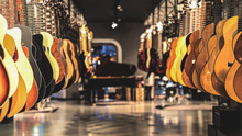 Guitars, Showcase With Guitars Hanging In A Row