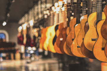 Wall Mural - guitars, showcase with guitars hanging in a row