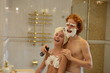 loving couple in the bathroom shaving foam