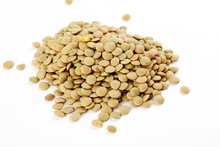 Pile Of Green Lentils On A White Background