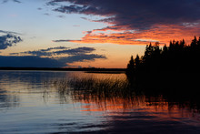 Brilliant Evening Sunset Reflecting Over Calm Lake
