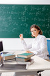 © Elnur - Female math teacher in front of the chalkboard