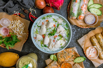 Wall Mural - Assorted asian dinner, vietnamese food. Pho ga, pho bo, noodles, spring rolls
